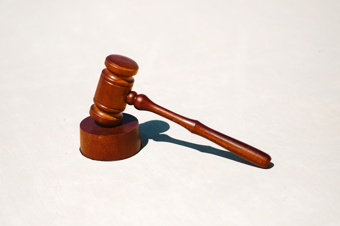 wooden gavel resting on a circular base